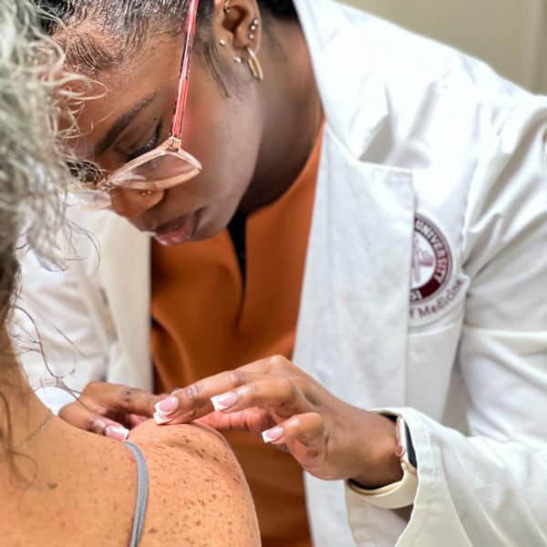 Doctor Looking At Skin