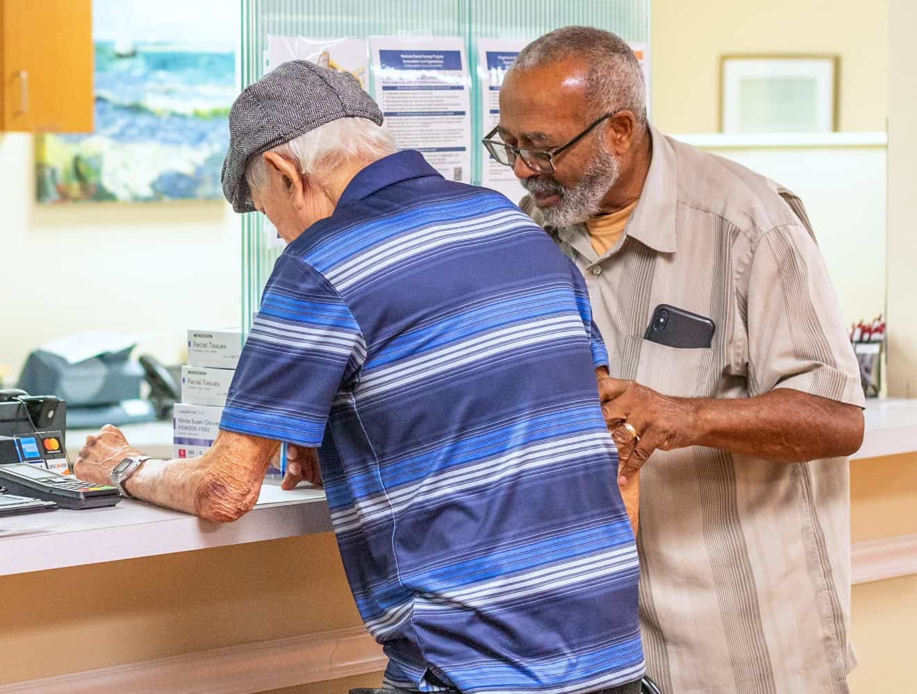 Men At Reception Desk